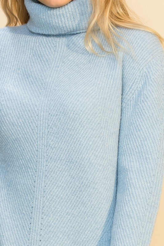 Suéter tono azul celeste